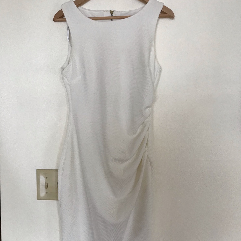 White sleeveless dress.